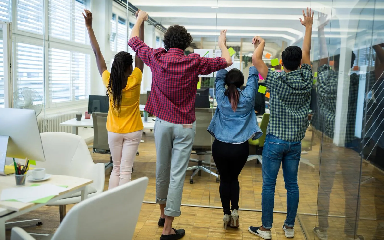 People collaborating around a project board